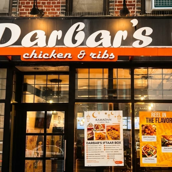 The exterior of Darbar's Chicken & Ribs restaurant, featuring its sign and window advertisements.